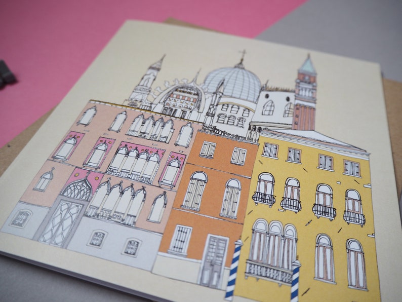 May include: A hand-drawn illustration of a cityscape with buildings in shades of pink, yellow, and orange. The buildings have arched windows and intricate details. The illustration is done in a whimsical style.