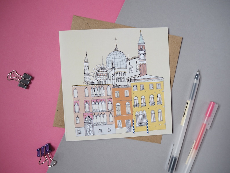 May include: A hand-drawn illustration of a building with a dome and a bell tower, surrounded by other buildings. The illustration is in black and white with some color accents.