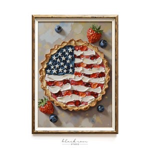 May include: A framed painting of a pie decorated as the American flag. The pie crust is golden brown, and the filling is made of red and white brushstrokes. Fresh strawberries and blueberries surround the pie.