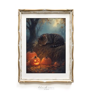 May include: Framed print depicting a tabby cat asleep on a hay bale in a forest. Several orange pumpkins, including a carved jack-o'-lantern, are at the base. The artwork has a vintage, autumnal theme, with a gold-colored frame.