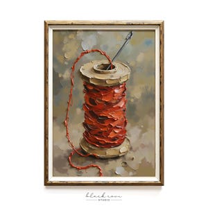 May include: Oil painting of a spool of red thread with a needle piercing the top. The thread is wound around a tan spool. The background is a textured blend of tan, gray, and brown. The artwork is in a gold-toned frame.