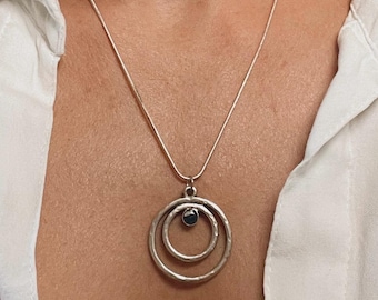 Circles Upon Circles Pendant – Hammered Silver Necklace with Ocean Resin Center | Flowing Waves in a Symbol of Wholeness
