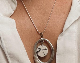 Marbled Earth Pendant – Hammered Silver Oval Frame with Black & White Clay Drop | One-of-a-Kind Natural Elegance