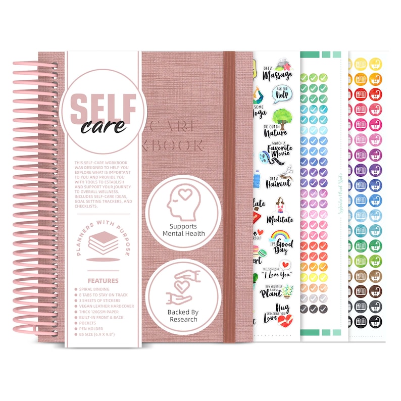 A pink journal with three sheets of stickers