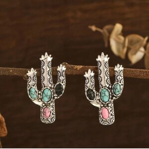 Brand new Turquoise and silver plate studded cactus earrings.