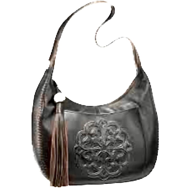 May include: Black leather shoulder bag with a decorative floral design on the front. The bag has a long strap, a brown tassel, and a silver-colored ring. The bag is made of leather and has a curved shape.