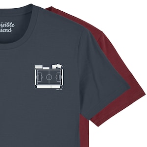 May include: Two short-sleeved t-shirts, one navy blue and one maroon, are layered. The navy shirt has a white graphic of a football pitch on the chest. The text "visible friend" is printed on the upper left side of the navy shirt.
