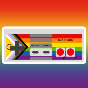 May include: A white Nintendo controller with a rainbow design and the text "Nintendo". The controller features a Pride flag design on the left side, with the words "SELECT" and "START" in the center, and red A and B buttons on the right.