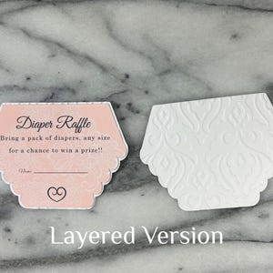 May include: Two hexagonal baby shower raffle cards. One is pink with the text "Diaper Raffle" and details. The other is white with a floral embossed design. The words "Layered Version" are at the bottom.