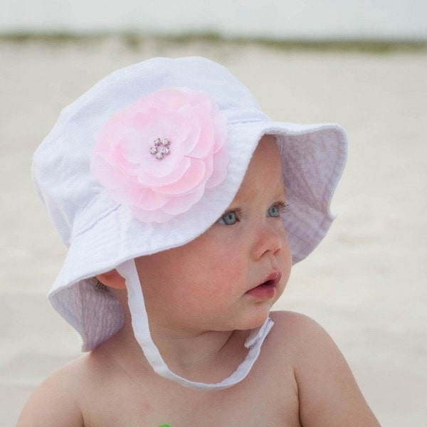 White Infant Bucket Summer Sun Hat with chin strap and YOU CHOOSE 1 interchangeable layered rhinestone center hair flower clip choose color azalea/hot pink, light pink, orange, yellow, red, lavender, pink - fits about 3/6 months to about 18 months