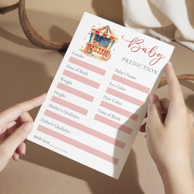 May include: A pink and white baby shower prediction card with a cartoon illustration of a carnival food cart. The card has spaces to fill in the baby's name, gender, date of birth, weight, height, eye color, hair color, time of birth, and qualities of the parents.