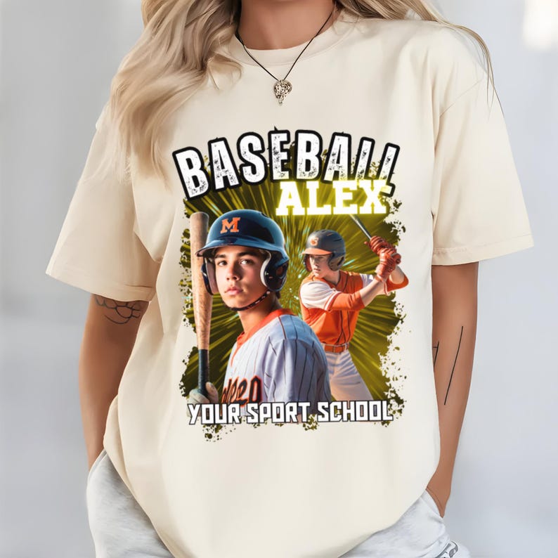 May include: Cream-colored t-shirt featuring a baseball theme. The shirt displays the text "BASEBALL ALEX" above an image of a baseball player in a helmet and uniform, holding a bat. The text "YOUR SPORT SCHOOL" is also visible.