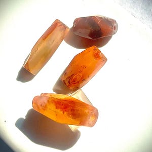 An Collection of Four Authentic  Bronze Age (~3200-1200BCE)/Neolithic Carnelian Tibetan/Nepalese Sacred Pema Raka Amulet Beads.