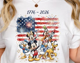 May include: White t-shirt featuring a patriotic design with the American flag and fireworks. The shirt includes the text "1776-2026" and "America - 250th Anniversary". Disney characters Mickey Mouse, Minnie Mouse, Donald Duck, Daisy Duck, Goofy, and Pluto are also featured.