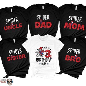 May include: Set of six black and white t-shirts with a Spiderman theme. The shirts feature the text "Spider Uncle", "Spider Dad", "Spider Mom", "Spider Sister", "My 3rd Birthday Alex", and "Spider Bro".