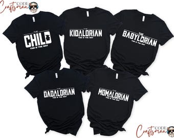 May include: Five black t-shirts with white text. The shirts read "The Child This is the Way", "The Kidalorian This is the Way", "The Babyloarian This is the Way", "The Dadalorian This is the Way", and "The Momalorian This is the Way".