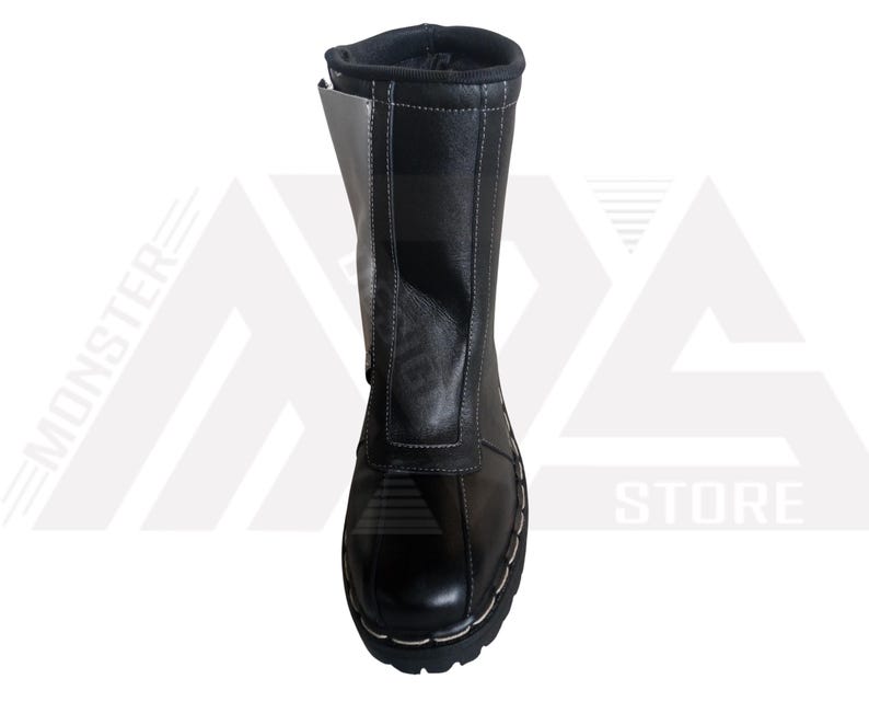 May include: Black leather boots with a white panel on the side. The boots have a lace-up closure and a thick sole.