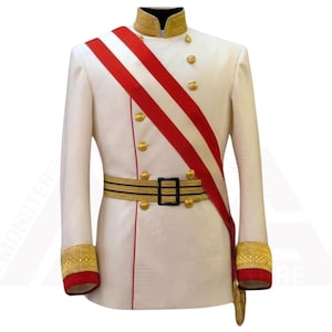 May include: A white military-style jacket with gold buttons, trim, and a black and gold belt. A red and white sash is draped across the front. The cuffs are red with gold embroidery. A formal jacket.