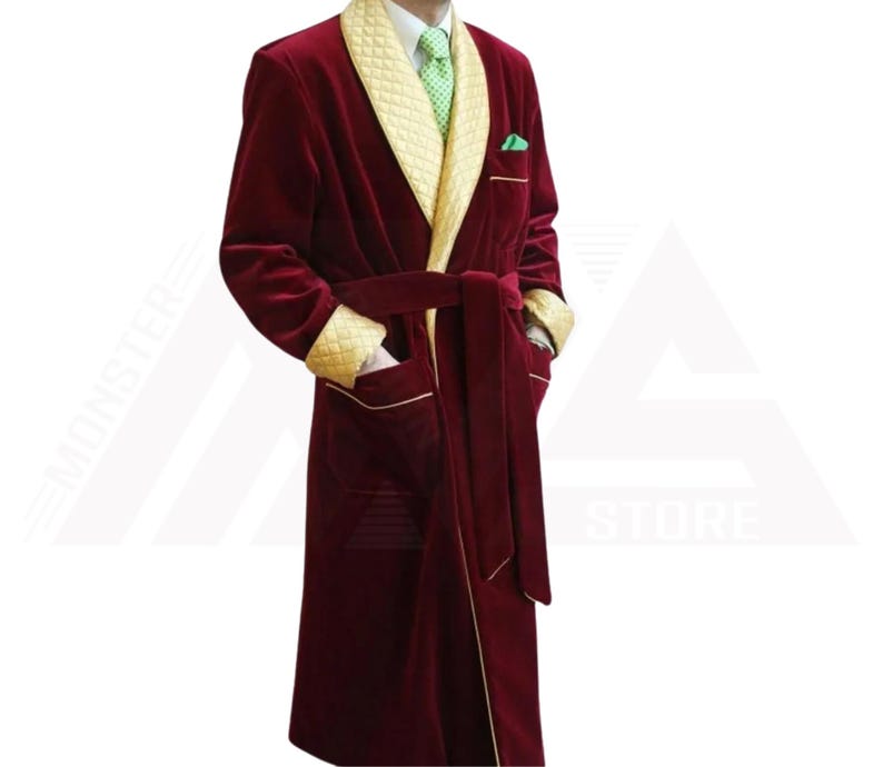 May include: A burgundy velvet robe with a gold satin trim and a matching belt. The robe has a shawl collar and two pockets.