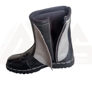 May include: Black leather boots with a zipper up the back and a gray leather panel on the side.