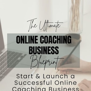 May include: A laptop computer with a notebook and pen on a white desk. The text on the screen reads "The Ultimate Online Coaching Business Blueprint Start & Launch a Successful Online Coaching Business WITH RESELL RIGHTS Mom's Gone Digital".