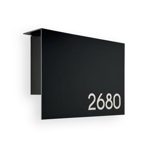 May include: Black metal house number plaque with the number 2680 in white lettering.