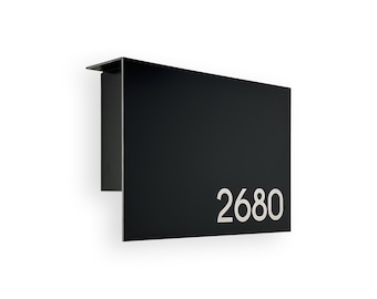 May include: Black metal house number plaque with the number 2680 in white lettering.