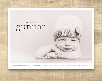 May include: A black and white photo of a baby boy named Gunnar, wearing a knitted hat. The photo is a birth announcement with the text "MEET gunnar." and "gunnar lee mitchell | february 23, 2018 | 6 lbs 5 oz 21 in | with love, kyle and julie".