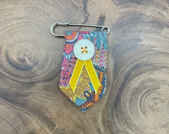 Repurposed patterned necktie lapel pin brooch