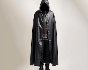 May include: A black leather hooded cape with a long, flowing design. The cape is worn over a brown leather jacket and black pants.