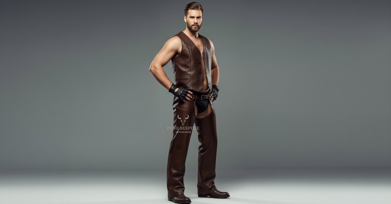 May include: A brown leather vest and chaps outfit. The vest has a V-neck and a zipper. The chaps are open in the back. The person is wearing black gloves and boots. The outfit is a dark brown color.