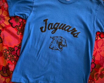 vintage 1990’s cobalt blue JAGUARS t-shirt high school ATHLETIC team big cat S single stitch USA 33” heavy metal parking lot