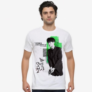 May include: White t-shirt with a graphic print of a man in a suit, a green background, and the text "기억못해? 그들이 했던 말은" and "멈춰! 죄사" in Korean.