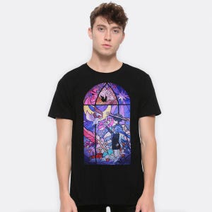 May include: Black t-shirt featuring a stained-glass style graphic. The graphic depicts a character in a hat and cloak, surrounded by other figures and a bird, in shades of purple, blue, pink, and white. The design is framed by a dark border.