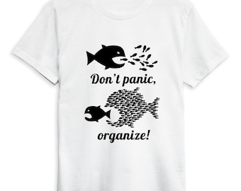 May include: White t-shirt with a black graphic of fish. One fish is expelling smaller fish, while another fish is composed of many smaller fish. The text "Don't panic, organize!" is printed below the fish illustrations.
