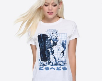 May include: White t-shirt with a blue and white graphic print of a woman holding a large shield. The graphic is on a grid background and includes the Japanese text "どろへどろ".
