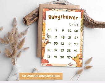 May include: A baby shower bingo card with a woodland theme. The card features a beige background with a colorful border of leaves and forest animals. The card has the word "Babyshower" at the top and numbers in the grid.