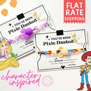 May include: Character-inspired bracelets with the text "You've Been Pixie Dusted." One bracelet features a purple flower charm, the other a Mickey Mouse charm. The image includes Disney character illustrations.
