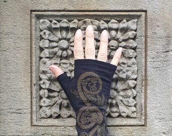 Black merino wool fingerless gloves, printed with fern koru design in dark gold, armwarmers, mittens.