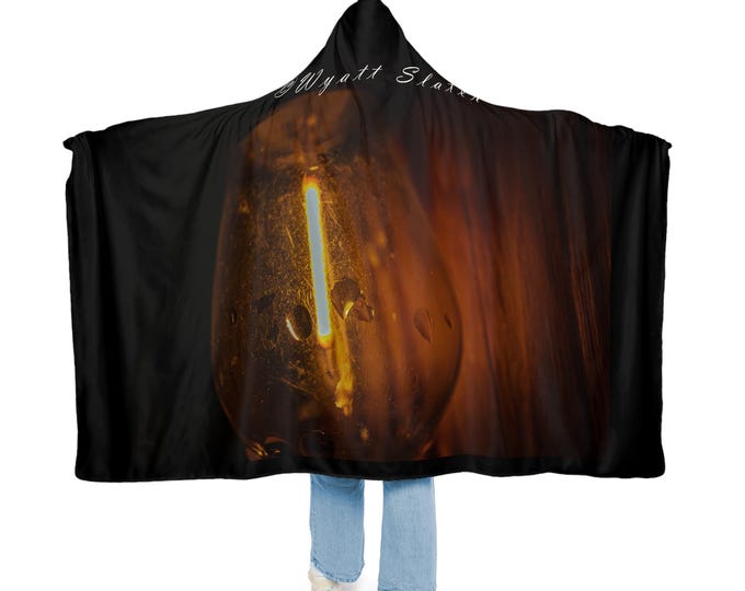 Snuggle Blanket Hoodie: Plush Polyester Sherpa Lining.