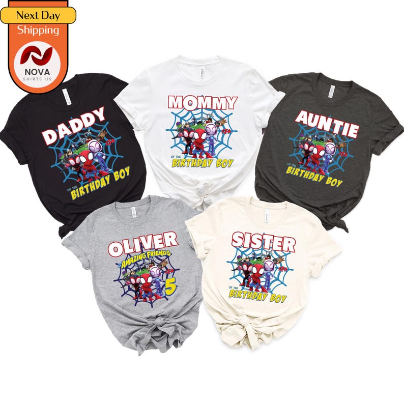 May include: Five t-shirts with a Spider-Man theme. The shirts are in black, gray, white, and beige. The shirts have different text on them, including "Daddy", "Mommy", "Auntie", "Oliver", and "Sister".