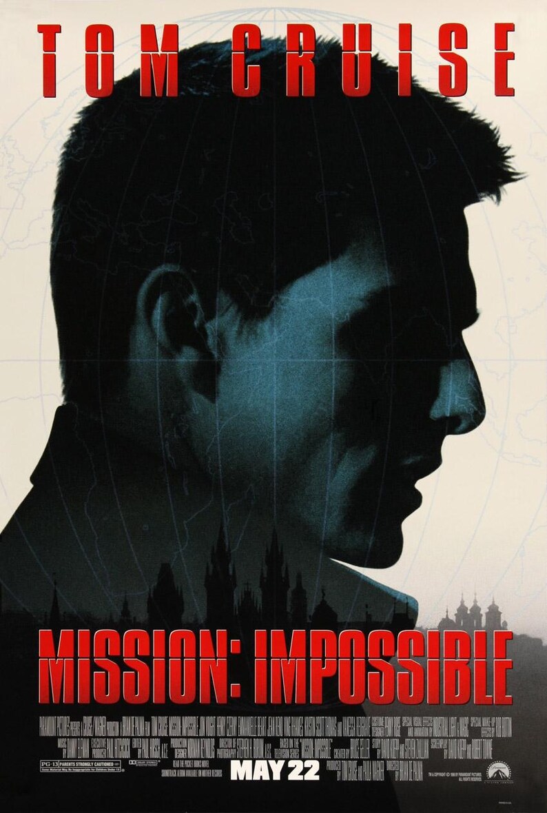 May include: A movie poster for the film "Mission: Impossible" featuring Tom Cruise in a silhouette against a world map background. The title of the film is in red text and the release date "MAY 22" is at the bottom of the poster.