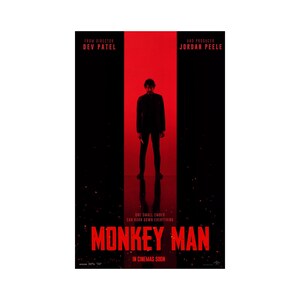 May include: A movie poster for the film "Monkey Man" directed by Dev Patel and produced by Jordan Peele. The poster features a silhouette of a man in a suit standing in a red doorway with the title of the film in large red letters.