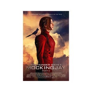 May include: Movie poster for The Hunger Games: Mockingjay Part 2. The poster features a young woman in a red jumpsuit with a mockingjay bird perched on her shoulder. The background is a dramatic sunset with clouds. The text "The Hunger Games: Mockingjay Part 2" is displayed in large, bold letters. The release date "November 20" is also displayed on the poster.