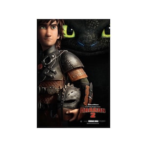 May include: A movie poster for How to Train Your Dragon 2, featuring a young man with brown hair and a black and green dragon. The man is wearing a brown leather vest and a black helmet. The dragon is in the background, with its green eyes glowing. The text "How to Train Your Dragon 2" is in red letters at the bottom of the poster.