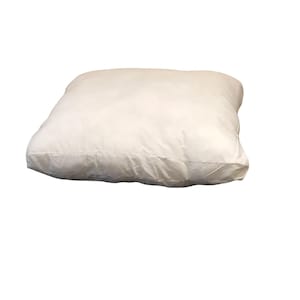 May include: A white, rectangular pillow with a soft, fluffy texture. The pillow is made of a lightweight fabric and is perfect for adding comfort to any bed or sofa.