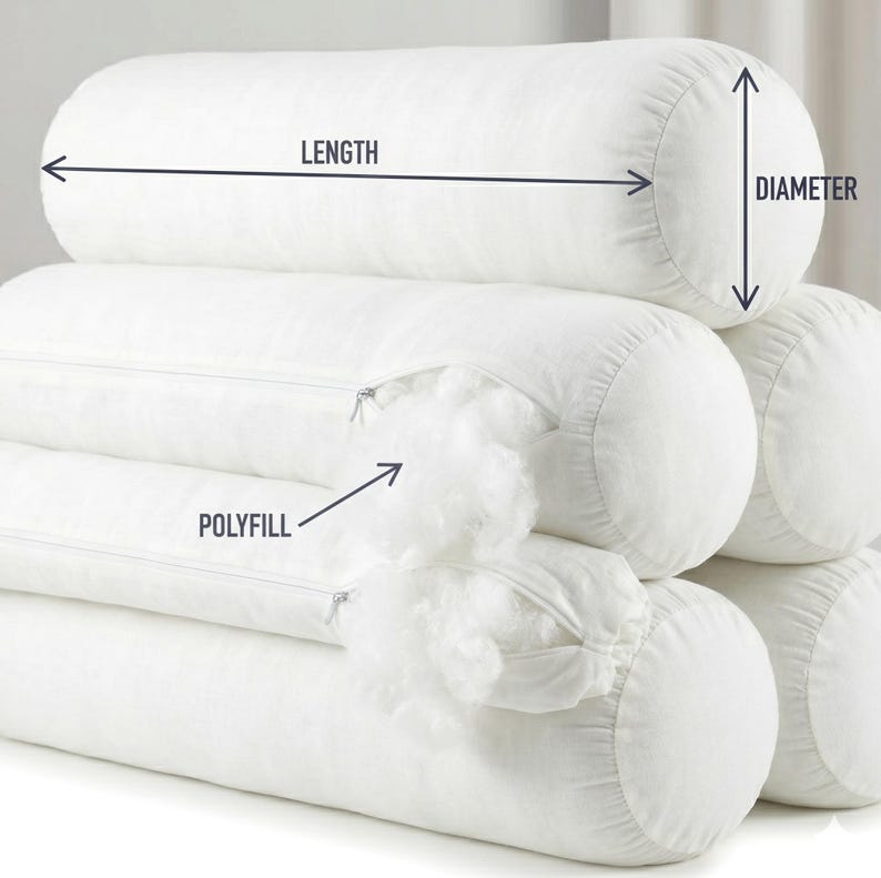 May include: White bolster pillows stacked, with a visible zipper and polyfill. The image shows the length and diameter of the pillows. These cylindrical pillows are designed for comfort and support. The pillows are approximately 30 inches long.