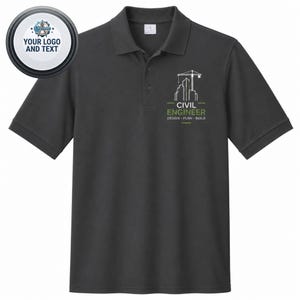 May include: A dark gray short-sleeve polo shirt featuring a white and green embroidered graphic on the left chest. The graphic depicts a construction crane and buildings with the text CIVIL ENGINEER DESIGN PLAN BUILD. A circular logo is at the top left.