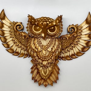 Thirteen layer engraved owl.  Varied colors of the engrave along with the layers give this owl depth and dimension.