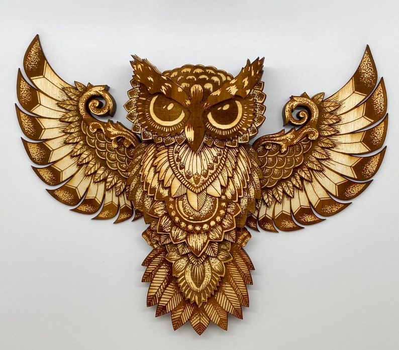 Thirteen layer engraved owl.  Varied colors of the engrave along with the layers give this owl depth and dimension.